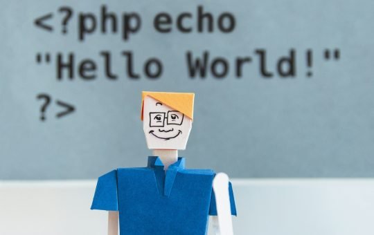 Papercraft toy with code in the background as LG AI Research has unveiled EXAONE Deep, a reasoning artificial intelligence model that excels in complex problem-solving across maths, science, and coding.