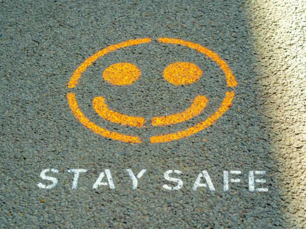 Stay safe written on the floor as Anthropic has detailed its safety strategy to try and keep its popular AI model, Claude, helpful while avoiding perpetuating harms.