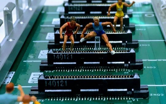 Figures hurdling on a computer board as while politicians tout AI’s promise of growth and efficiency, a new report reveals a public trust deficit in the technology.